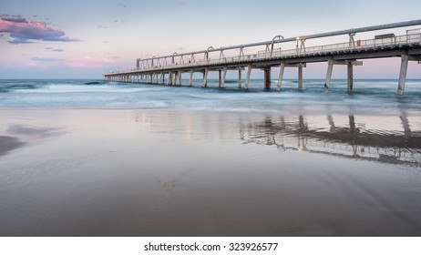 The Gold Coast Iconic Fishing Jetty With a Misty Ocean During a Beautiful Sunset, The Spit, Philip Park, Main Beach, Queensland, Australia