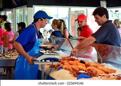 GOLD COAST - OCT 05 2014:Customers Buying Sea Food In Charis Seafood. It's One Of The Most Famous And Largest Seafood Outlets In The Gold Coast Queensland, Australia.