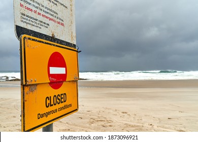 Gold Coast, QLD, Australia,December 13 2020 Danger Beach Closed Sign warning people during heavy rain and big ocean swells at popular surf spot Currumbin Rocks Gold Coast Australia.