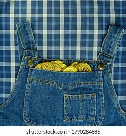 Gold Coins In A Denim Overalls Pocket. Financial Well-being.