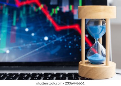 Gold coins dollars in an hourglass turn into sand. Financial bankruptcy in business.  - Powered by Shutterstock