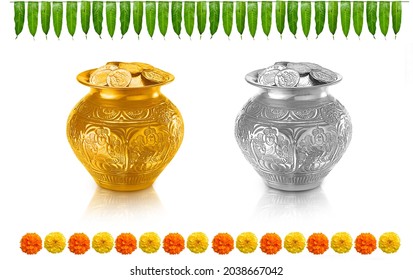 gold coins filled in gold pot (kalash) and silver coin filled in silver pot (kalash) an mango leaf thorana and marigold flowers for hindu festivals and poojas - Powered by Shutterstock