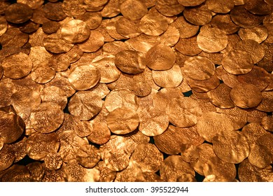 Gold coins, hoard of ancient medieval English currency. Full frame, background texture.
