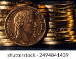 Gold coins of Napoleon III Emperor France on dark background