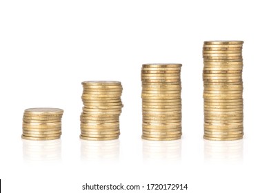 Gold coins stacked on a white background. Concept of saving money, economy, investment, growing business and wealth.