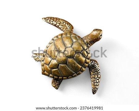 gold color sea turtle miniature animal on white background