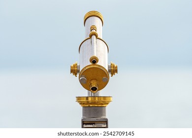 Gold colored telescopic viewing scope. - Powered by Shutterstock