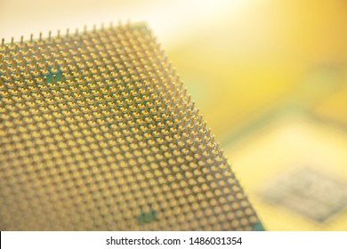 Gold computer CPU on a silver background Modern technology concepts. Selective focus image.