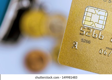 A Gold Credit Card And An Empty Wallet. Symbolic Photo For Cashless Transactions And Status Symbols.