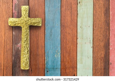 gold cross on retro colourful background