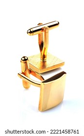 Gold Cuff Links On White Background