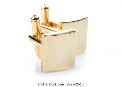 Gold Cuff Links On White Background