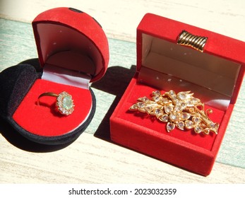 gold decorated with sparkling diamonds even though some of the stones are missing it still looks luxurious