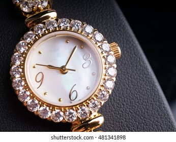 Gold Diamond Watch On Black Background