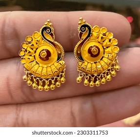Gold ear tops (Gold earring) peacock design gold earrings tops isolated  - Shutterstock ID 2303311753