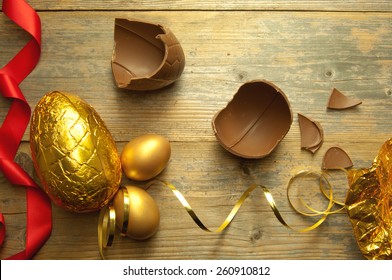 Gold Easter Egg With Broken Chocolate Pieces 