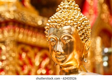 Gold face of Buddha statue in Doi Suthep temple, Chiang Mai, Thailand.