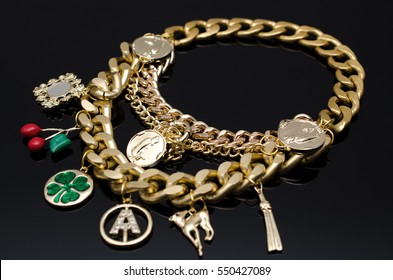 Gold Fashion Lucky Charm Bracelet On Black Isolated Background