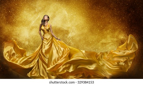 Gold Fashion Model Dress, Woman In Golden Silk Gown Flowing Fabric, Beautiful Girl on Stars Sky looking up