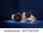 Gold fashionable and elegant watch, classic design high-end luxury brand watch for couples, blue style starry and dreamy background, black dial, gold strap, couple watch for men and women