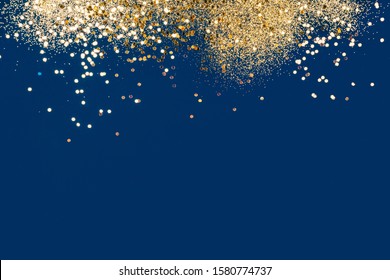 Gold Festive Confetti On Blue Background. Beautiful Background, Space For Text. Main Color Trend Concept.