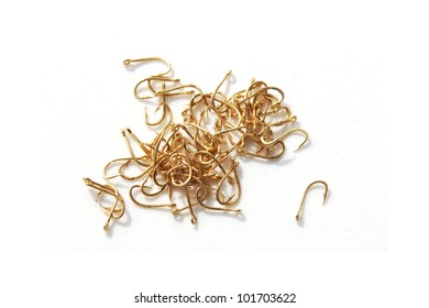 Gold fish hooks isolated on white background - Shutterstock ID 101703622