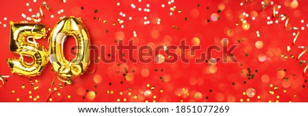 Gold foil balloon number, digit fifty. Birthday greeting card with inscription 50. Anniversary celebration event. Banner. Golden numeral, red background. Numerical digit, light bokeh, glitter