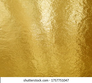 Gold Foil Texture Background With Highlights And Uneven Surface