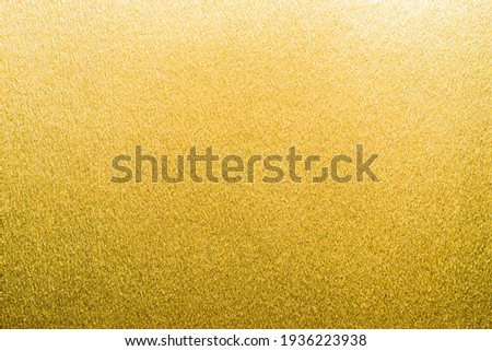Gold foil texture background metallic golden shinny wrapping paper bright yellow wall paper for design decoration element