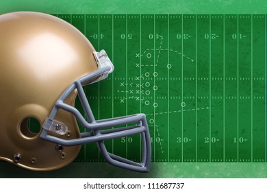 Gold Football Helmet Against Green Football Field With Diagram