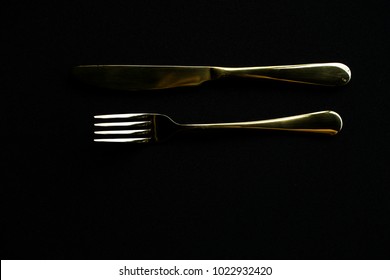 Gold Fork And Knife, Shot In A Low Key
