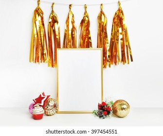 Gold frame mockup and gold tassel. White wall. Party frame