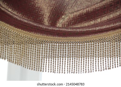 Gold Fringe On The Bard Curtain. Interior Items