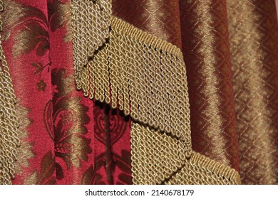 Gold Fringe On A Red Curtain. Backgrounds