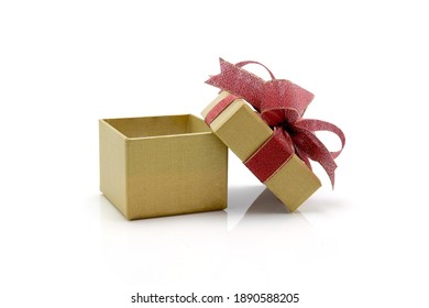 Gold Gift Box And Ribbon Open Isolated On White Background, Presents In Valentine Day Or Christmas Day, Object In Birthday Or Anniversary, Package With Wrap Luxury, Holiday And Festive Concept.