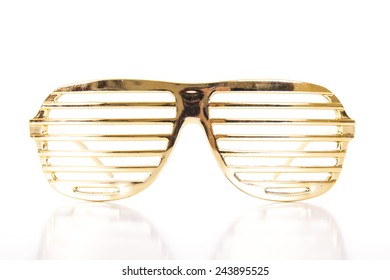 Gold glasses on white background