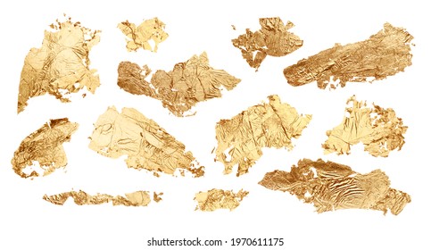 Gold glitter and bronze color blot. Abstract torn piece of metal leaf (potal) paper on white background. Collection.