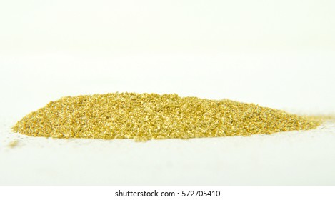   Gold Glitter Powder On White Background