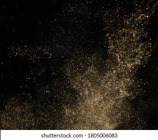 Gold Glitter Powder Splash On Black Background