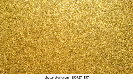 Gold glitter texture background sparkling shiny wrapping paper for Christmas holiday seasonal wallpaper  decoration  greeting   wedding invitation card design element