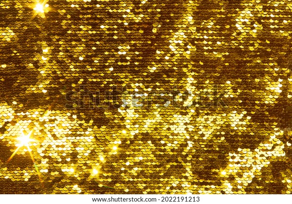 Gold glittering sequins sequins scales, great\
background for your design