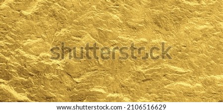 Gold grunge background. Gold stone background with copy space. Gold with rock texture.