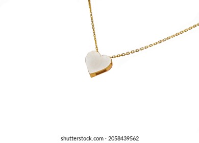 gold heart-shaped pendant on a gold chain - Powered by Shutterstock