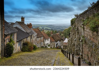 Gold Hill is a steep cobbled street in the town of Shaftesbury in the English county of Dorset. The view looking down from the top of the street has been described as "one of the most romantic sights 
