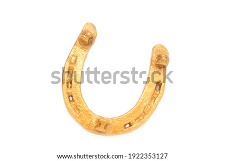 Gold horseshoe isolated on a white background. Top view