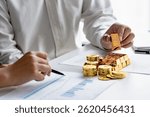 Gold Investing, hand holding gold for financial investment