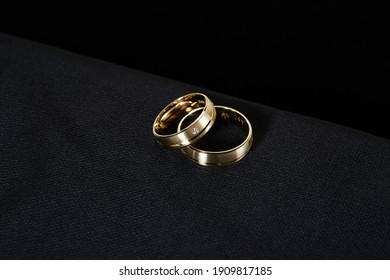 Gold Jewellery. Diamond Wedding Ring On Black Background