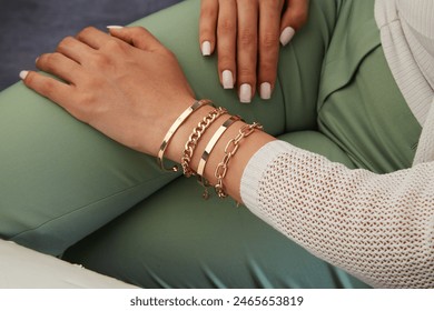 Gold jewelry. Gold bracelet on woman hand - Powered by Shutterstock