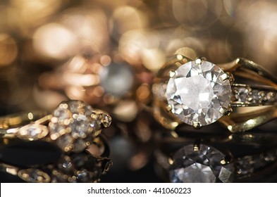Gold jewelry on a black background.