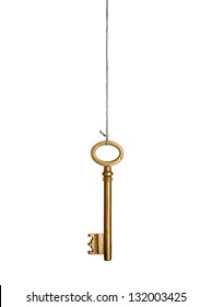 Gold Key, Hanging On A String. Isolated On White.